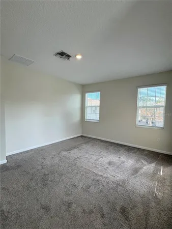 an empty room with windows