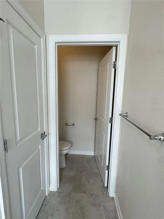 a view of a bathroom from a hallway
