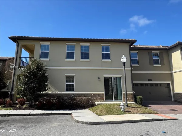 a house with palm tree in front of it