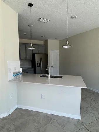 a view of a kitchen with a sink