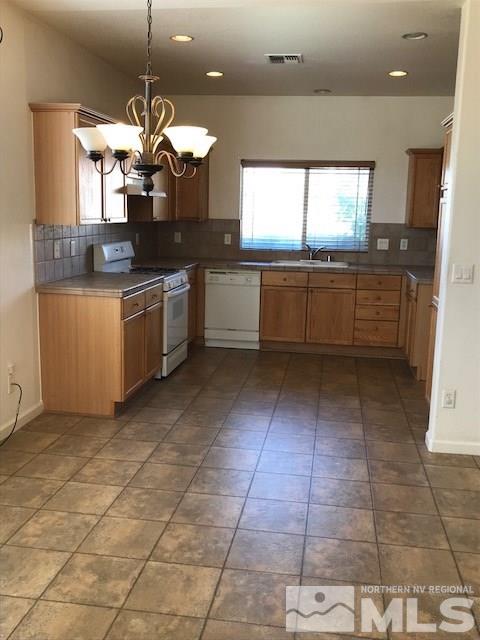 10575 Arbor Way Reno, NV 89521 - Photo 3 of 19 a kitchen with a cabinets and counter space