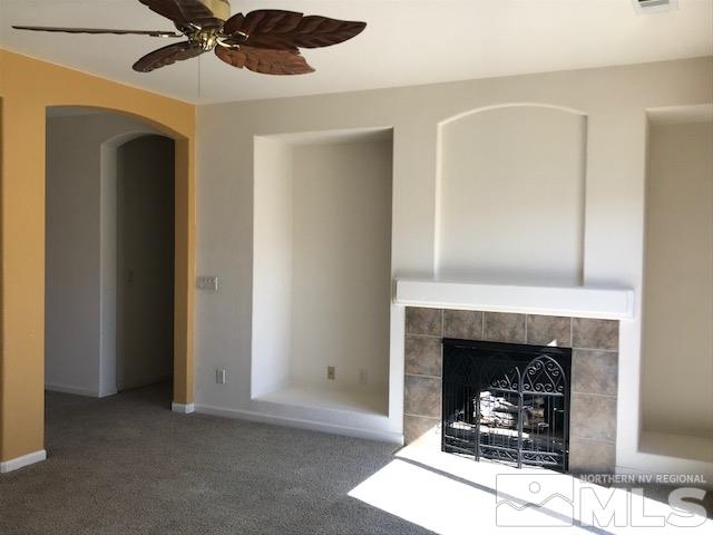 10575 Arbor Way Reno, NV 89521 - Photo 4 of 19 a living room with furniture and a fireplace