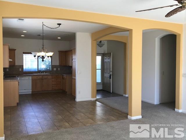 10575 Arbor Way Reno, NV 89521 - Photo 5 of 19 a view of a kitchen with refrigerator and a sink