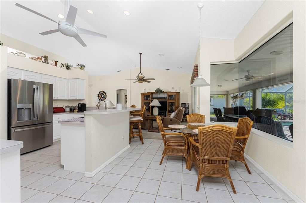 20 Long Meadow Place Rotonda West, FL 33947 - Photo 17 of 48 a kitchen with a dining table and chairs