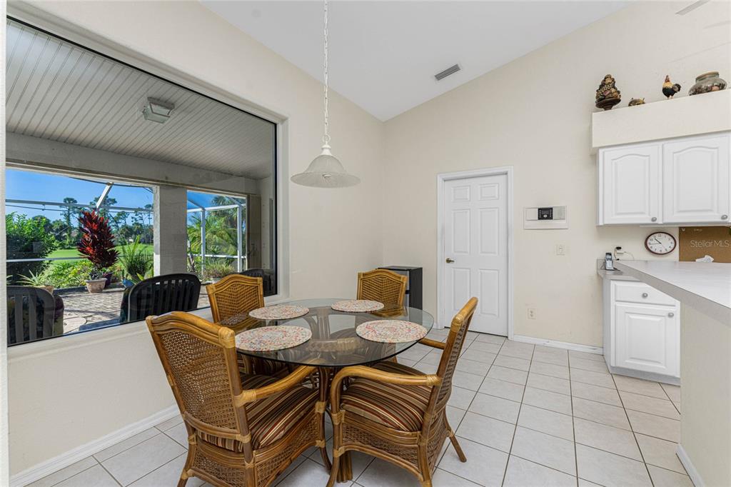 20 Long Meadow Place Rotonda West, FL 33947 - Photo 18 of 48 a view of a dining room with furniture window and outside view