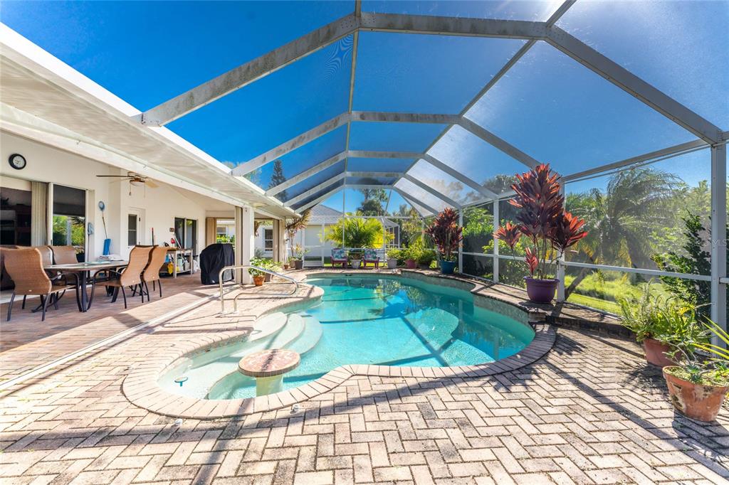 20 Long Meadow Place Rotonda West, FL 33947 - Photo 32 of 48 a view of a swimming pool with a patio