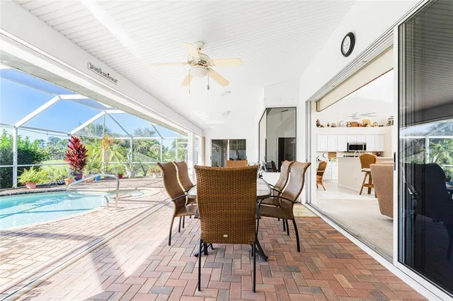 a view of a swimming pool with a patio