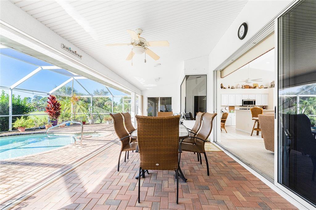 20 Long Meadow Place Rotonda West, FL 33947 - Photo 33 of 48 a view of a dining room with furniture window and wooden floor