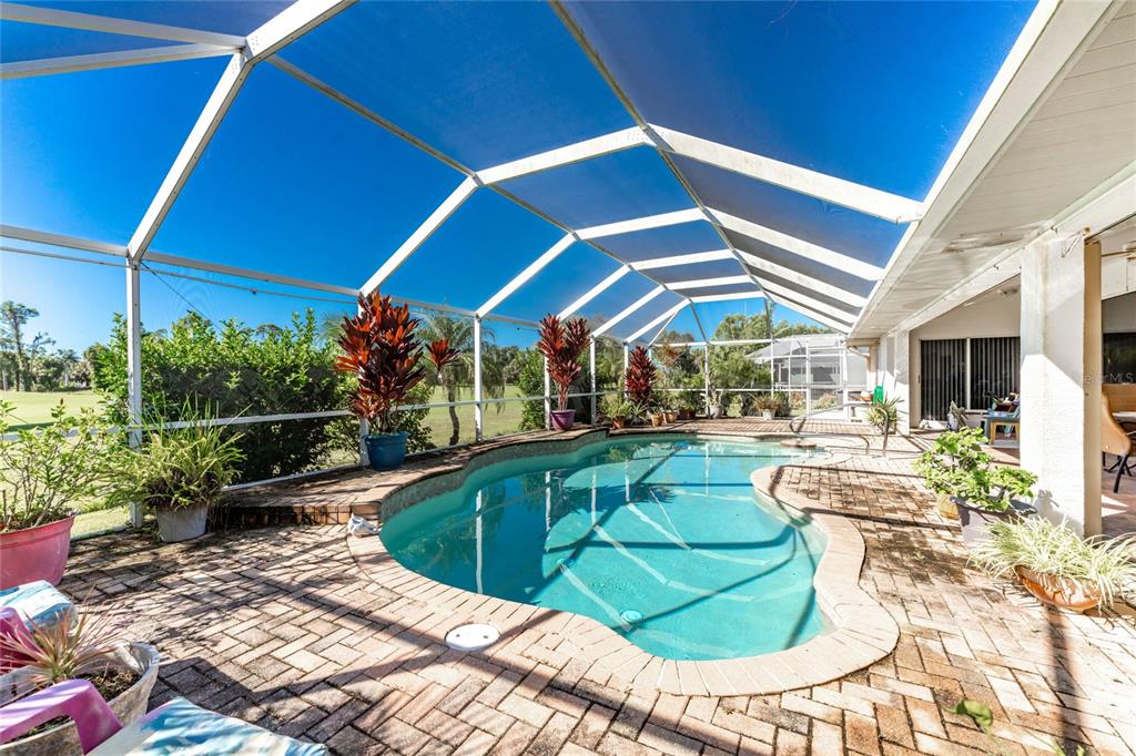 20 Long Meadow Place Rotonda West, FL 33947 - Photo 34 of 48 a view of a swimming pool with a patio