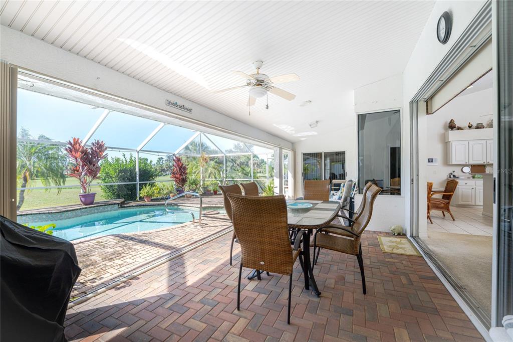 20 Long Meadow Place Rotonda West, FL 33947 - Photo 37 of 48 a dining room with furniture and wooden floor