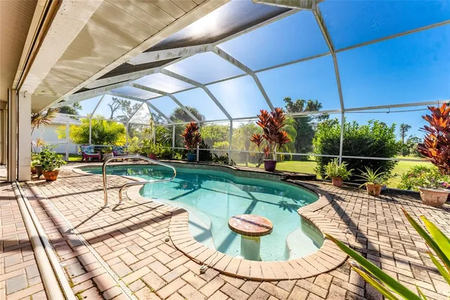a view of a swimming pool with a patio