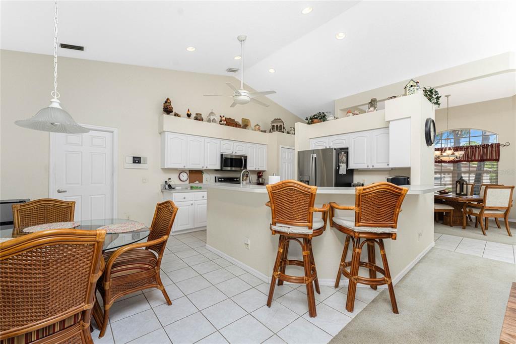 20 Long Meadow Place Rotonda West, FL 33947 - Photo 8 of 48 a dining room with furniture and a chandelier