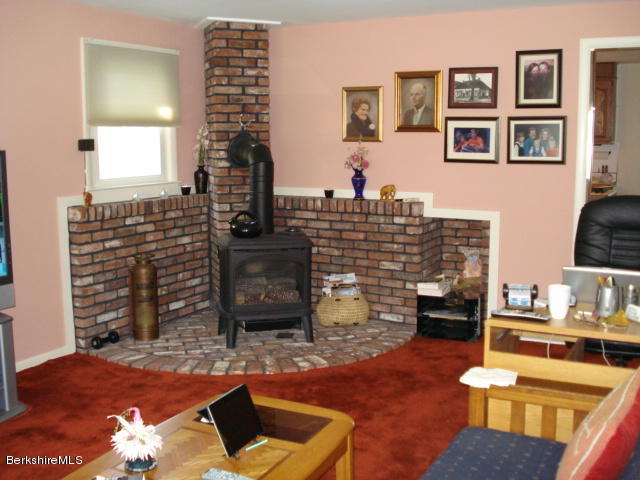 455 Pecks Road Pittsfield, MA 01201 - Photo 16 of 21 Gas Stove in Livingroom