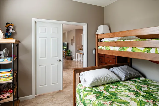 a bedroom with a bed and a television