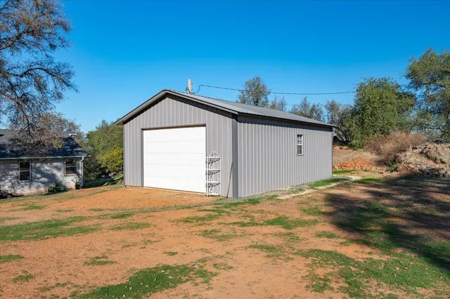 a view of a house with a road