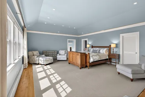 a bedroom with two beds and a window