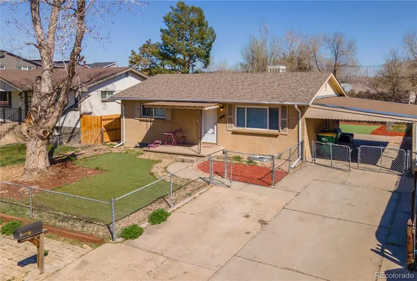 a view of a patio with a table and chairs