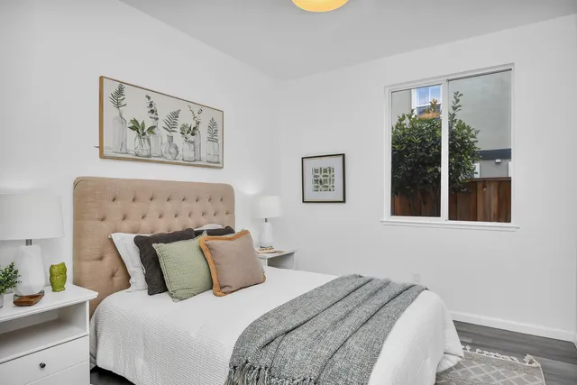 a bedroom with bed and window