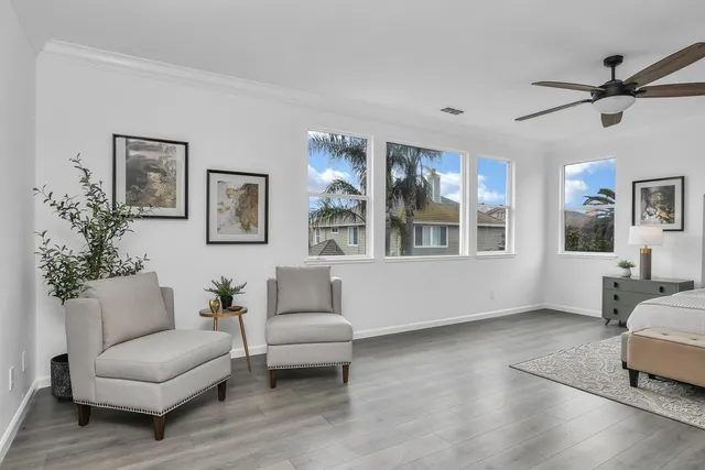 a living room with furniture and windows