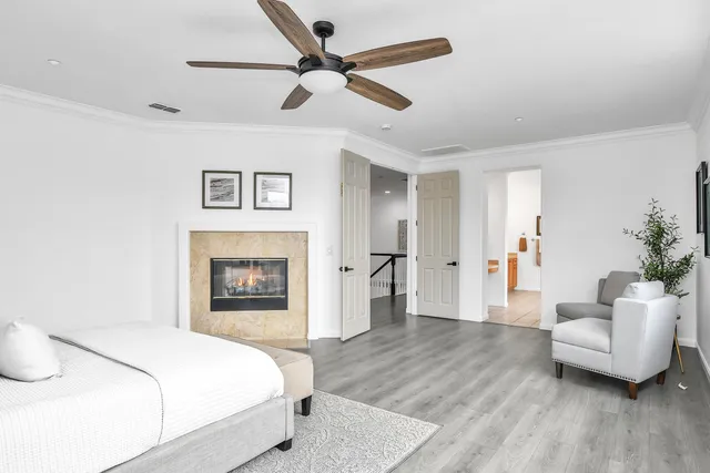 a spacious bedroom with a bed and a couch