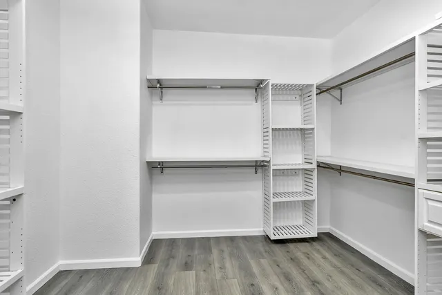 a view of an empty walk in closet