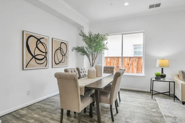 a dining room with furniture and window