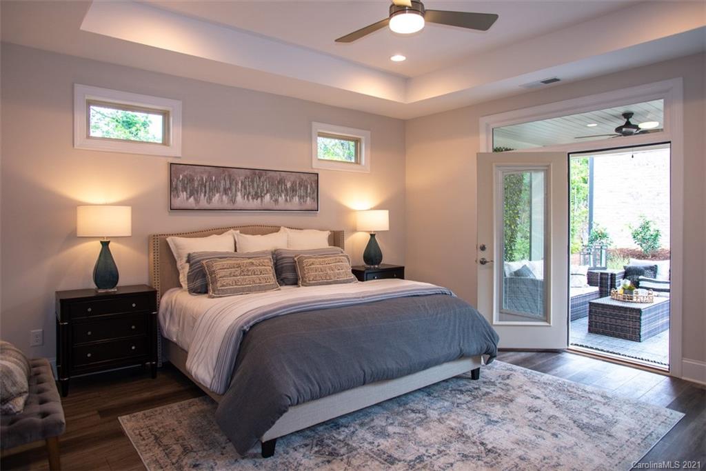 2064 New Style Way, Unit 40 Tega Cay, SC 29708 - Photo 13 of 16 a bedroom with a large bed and a window
