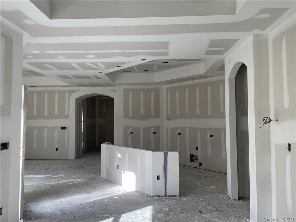 2064 New Style Way, Unit 40 Tega Cay, SC 29708 - Photo 3 of 16 a view of a hallway with entryway and cabinet