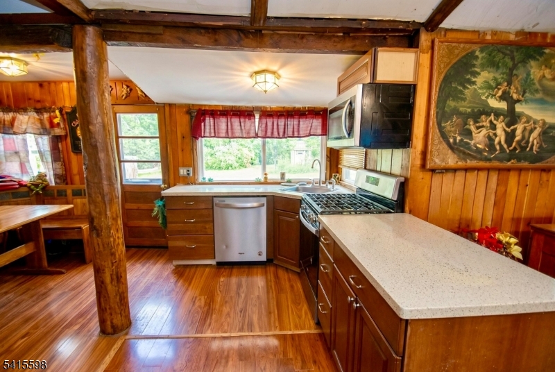 21 Grandview Avenue Oak Ridge, NJ 07438 - Photo 4 of 7 a kitchen with a stove a sink and a refrigerator