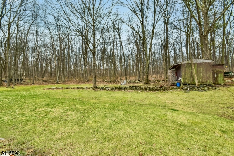 21 Grandview Avenue Oak Ridge, NJ 07438 - Photo 7 of 7 a view of outdoor space with deck and trees