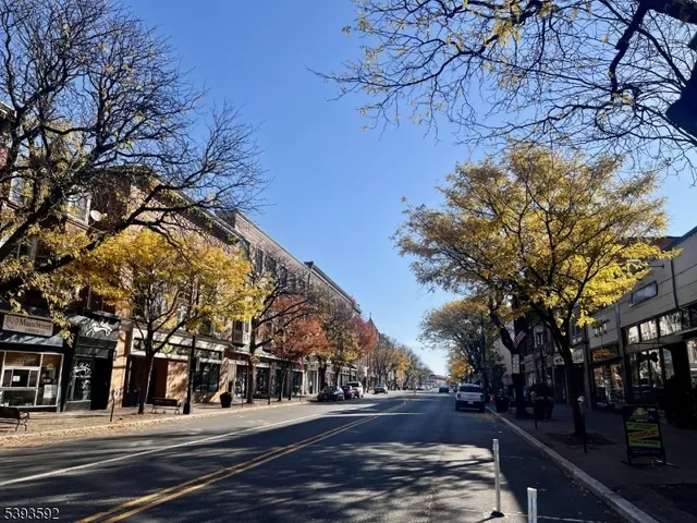 a view of street along with residential houses
