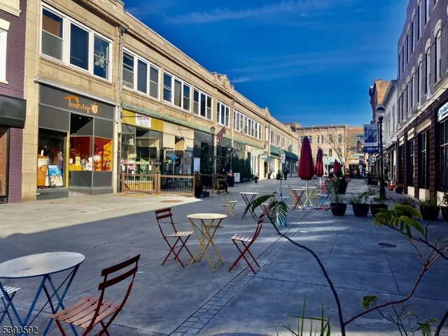 a view of a building with sitting area