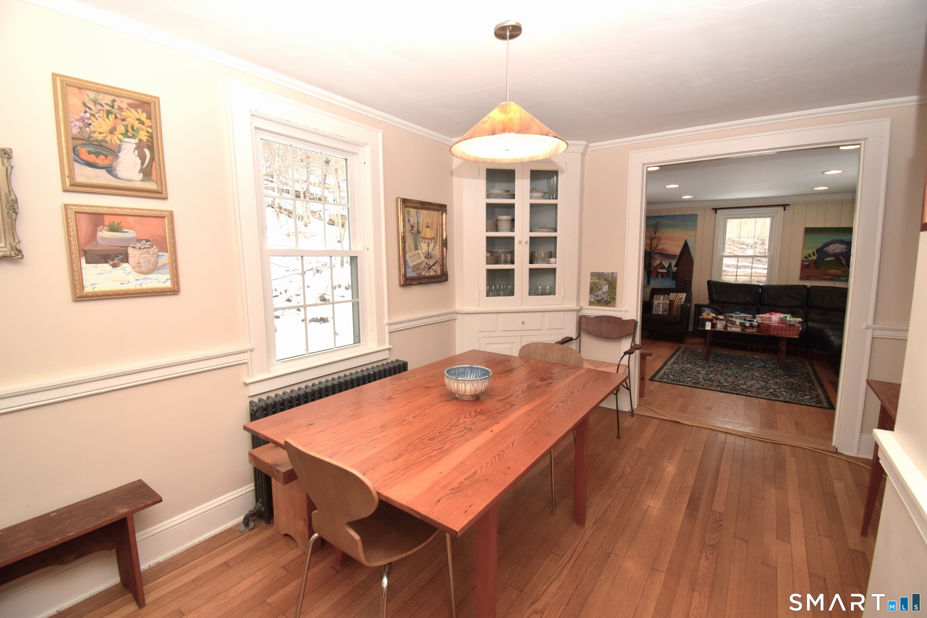 2203 Durham Road Madison, CT 06443 - Photo 11 of 18 a dining room with wooden floor and large windows