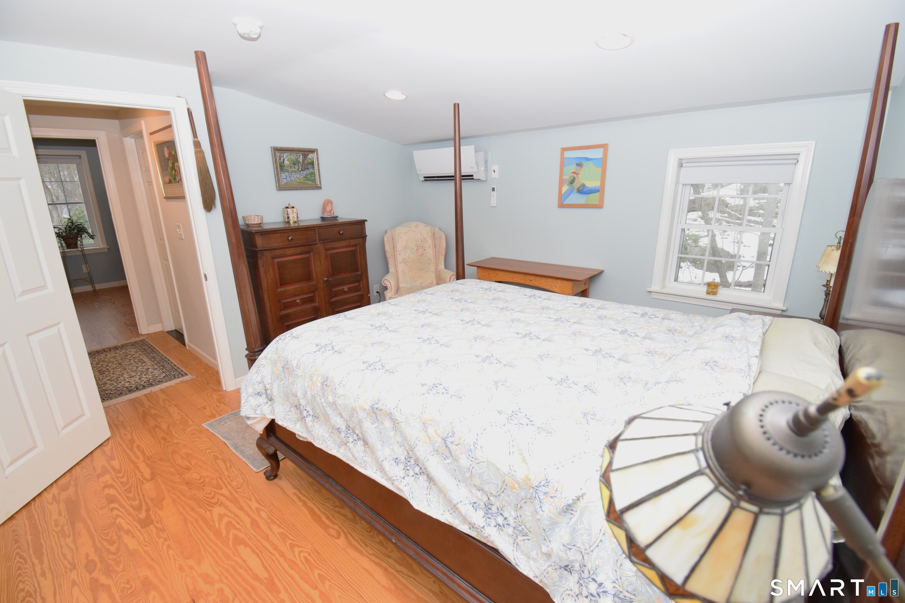 2203 Durham Road Madison, CT 06443 - Photo 16 of 18 a bedroom with a bed and a flat screen tv