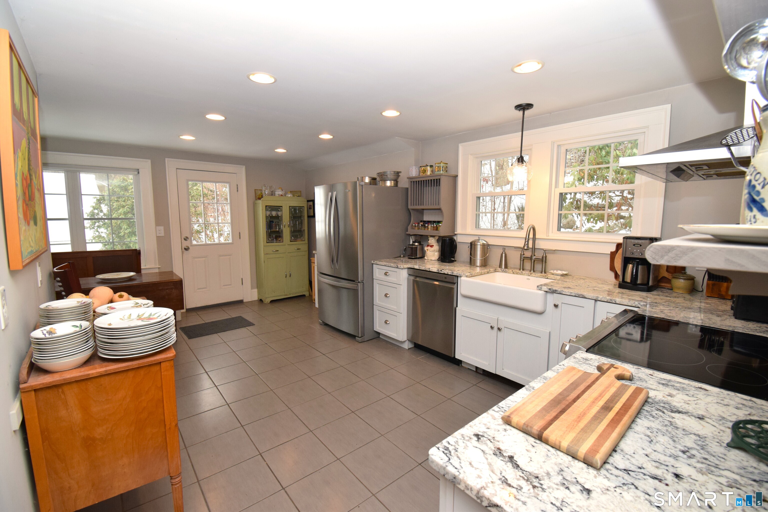 2203 Durham Road Madison, CT 06443 - Photo 6 of 18 a kitchen with stainless steel appliances kitchen island granite countertop a sink and cabinets