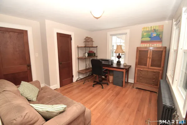 a workspace with furniture and a window