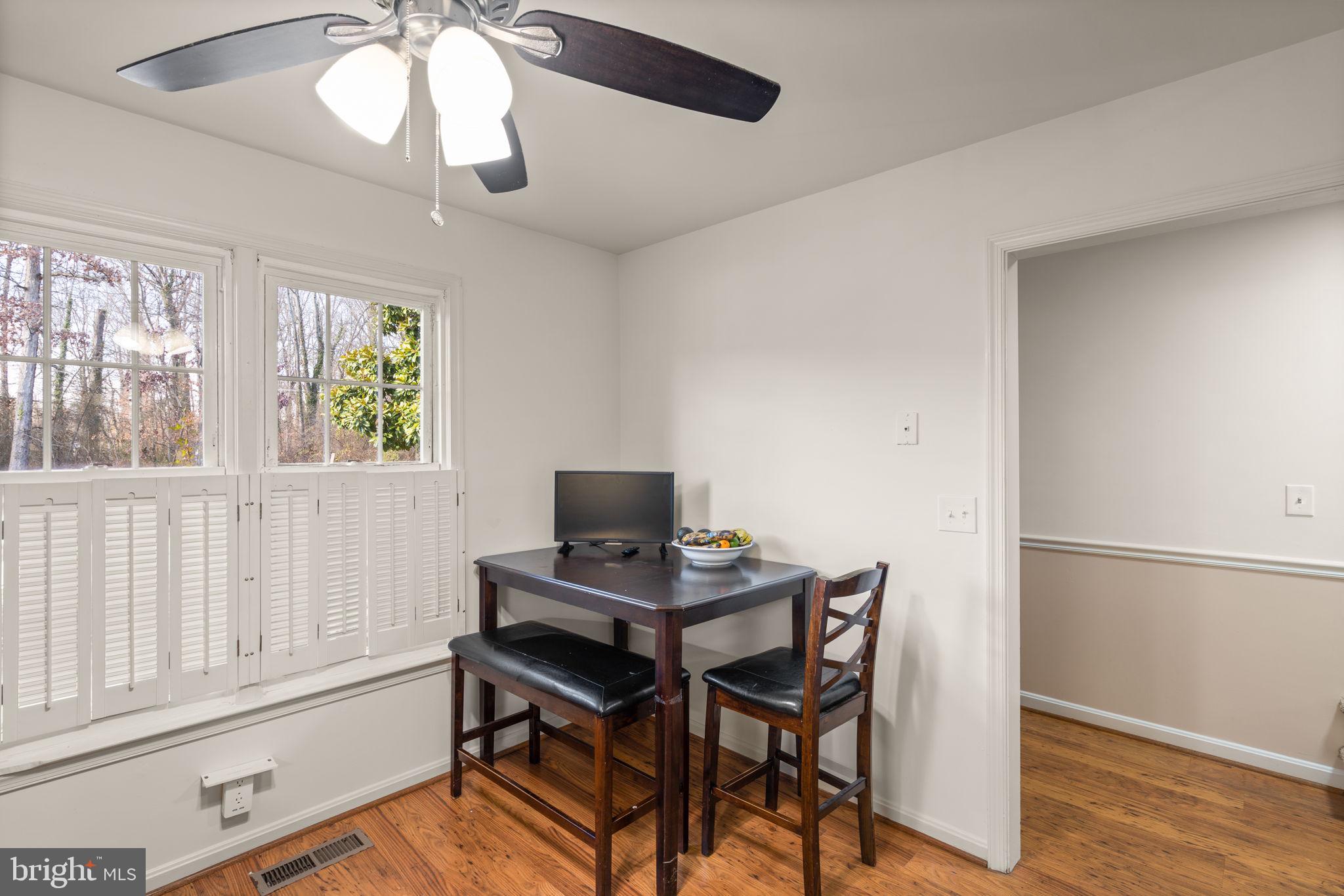1043 Windrush Lane, Unit 5 Sandy Spring, MD 20860 - Photo 13 of 28 a view of a workspace with furniture and a window