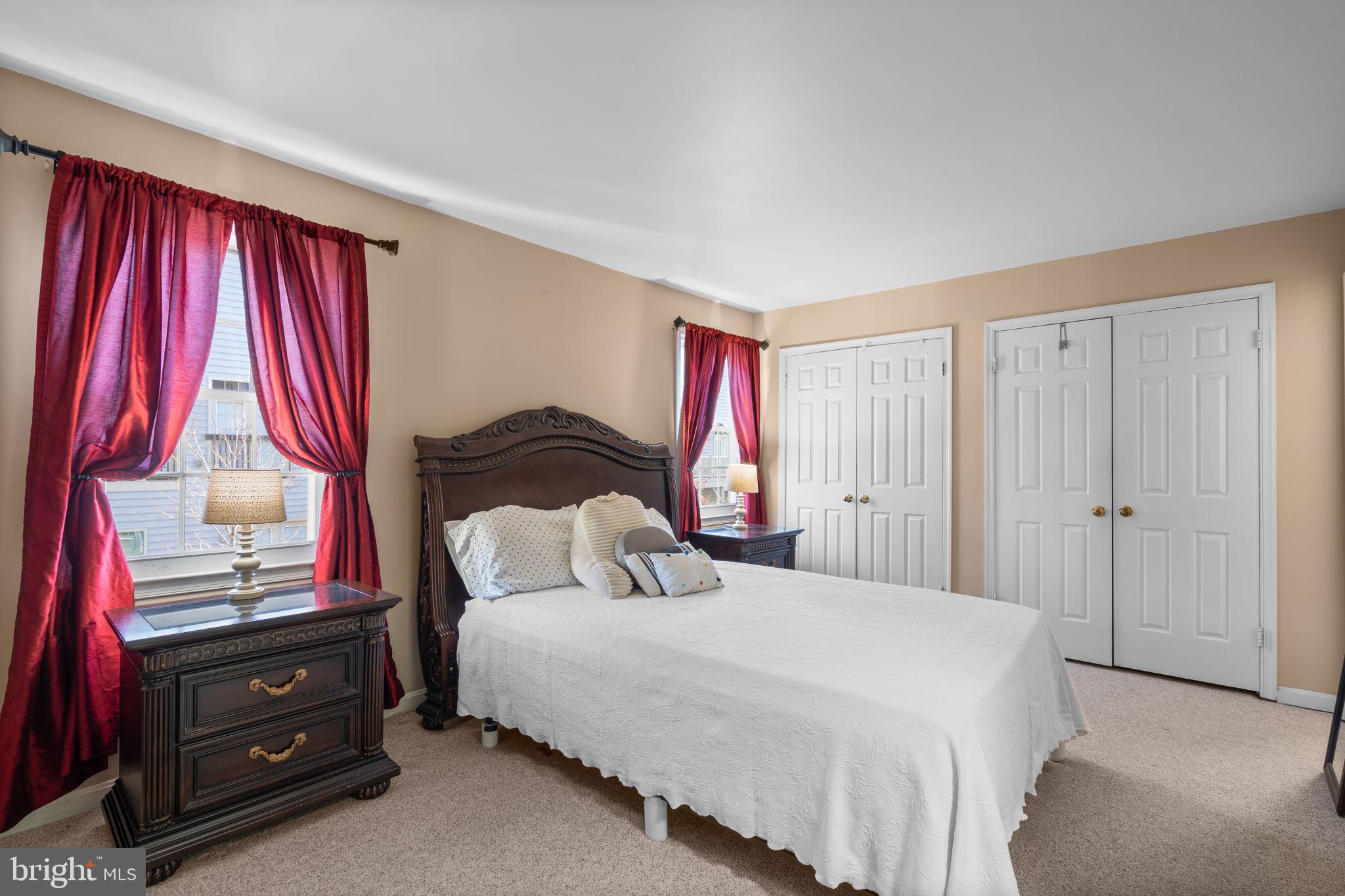 1043 Windrush Lane, Unit 5 Sandy Spring, MD 20860 - Photo 16 of 28 a bedroom with a bed and a window