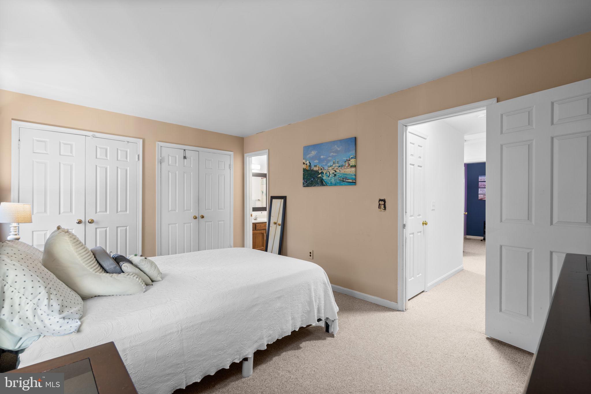 1043 Windrush Lane, Unit 5 Sandy Spring, MD 20860 - Photo 17 of 28 a bedroom with a bed and a window