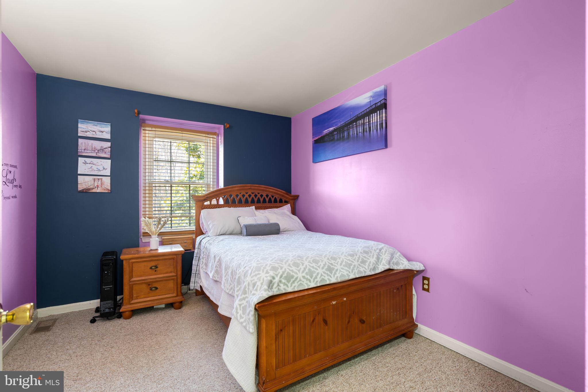 1043 Windrush Lane, Unit 5 Sandy Spring, MD 20860 - Photo 19 of 28 a bedroom with a bed and a window