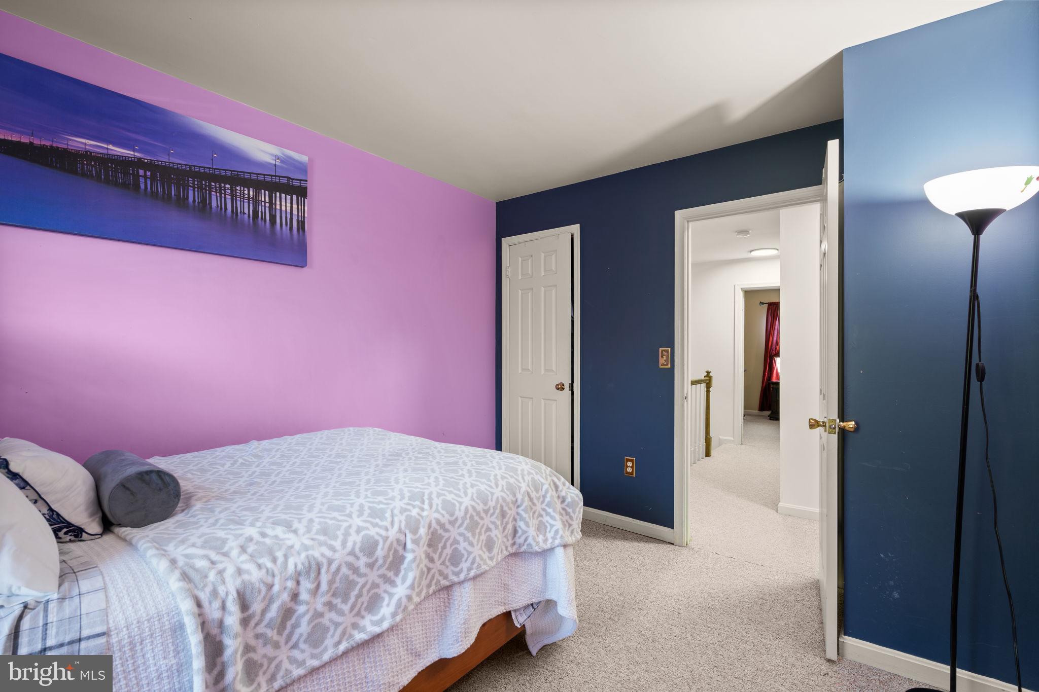 1043 Windrush Lane, Unit 5 Sandy Spring, MD 20860 - Photo 20 of 28 a bedroom with a bed and a mirror