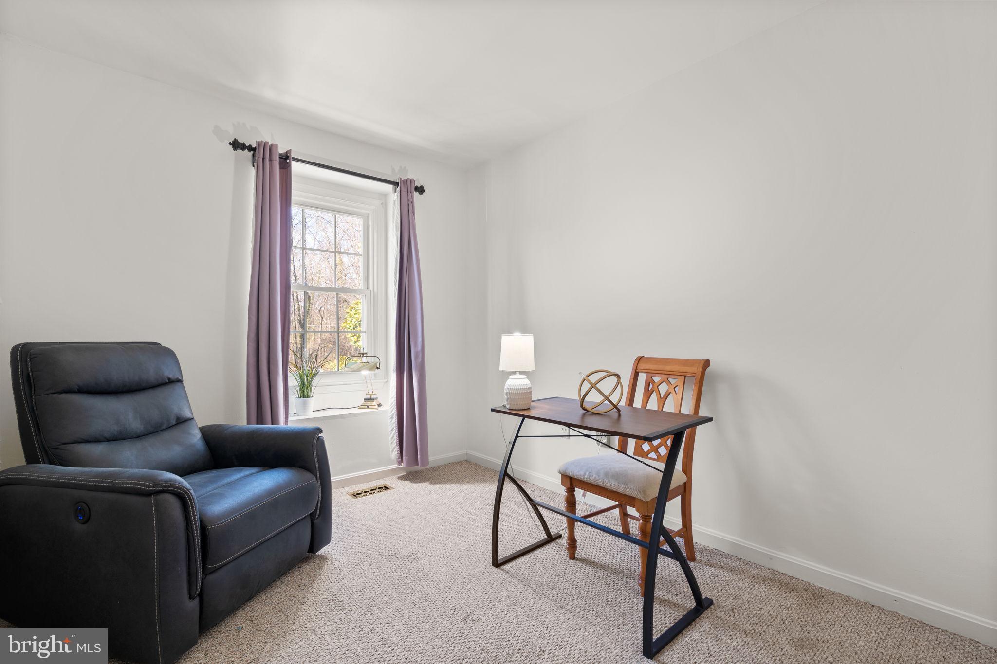 1043 Windrush Lane, Unit 5 Sandy Spring, MD 20860 - Photo 22 of 28 a living room with furniture and a window