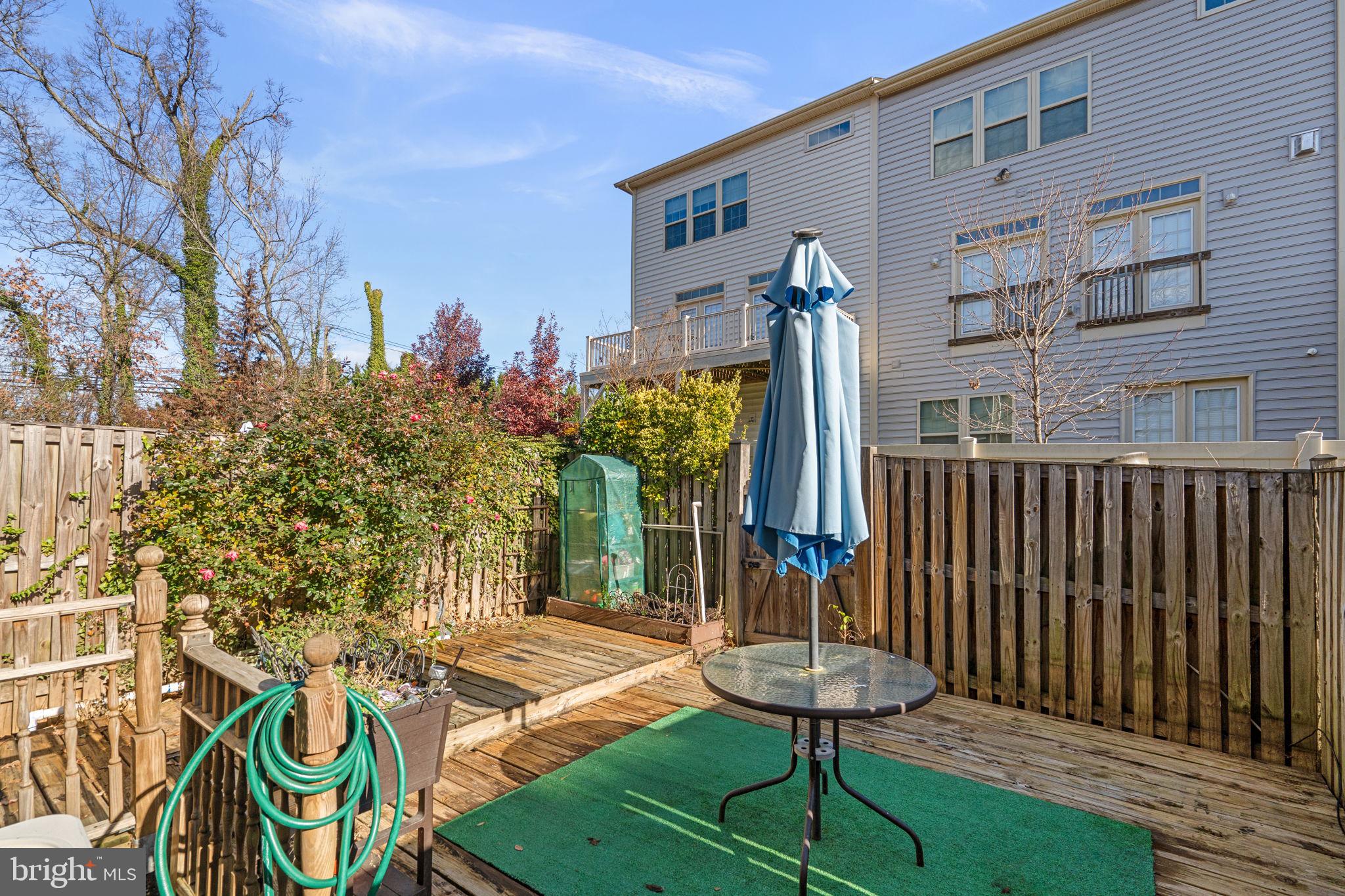 1043 Windrush Lane, Unit 5 Sandy Spring, MD 20860 - Photo 27 of 28 a view of a chairs and table in backyard