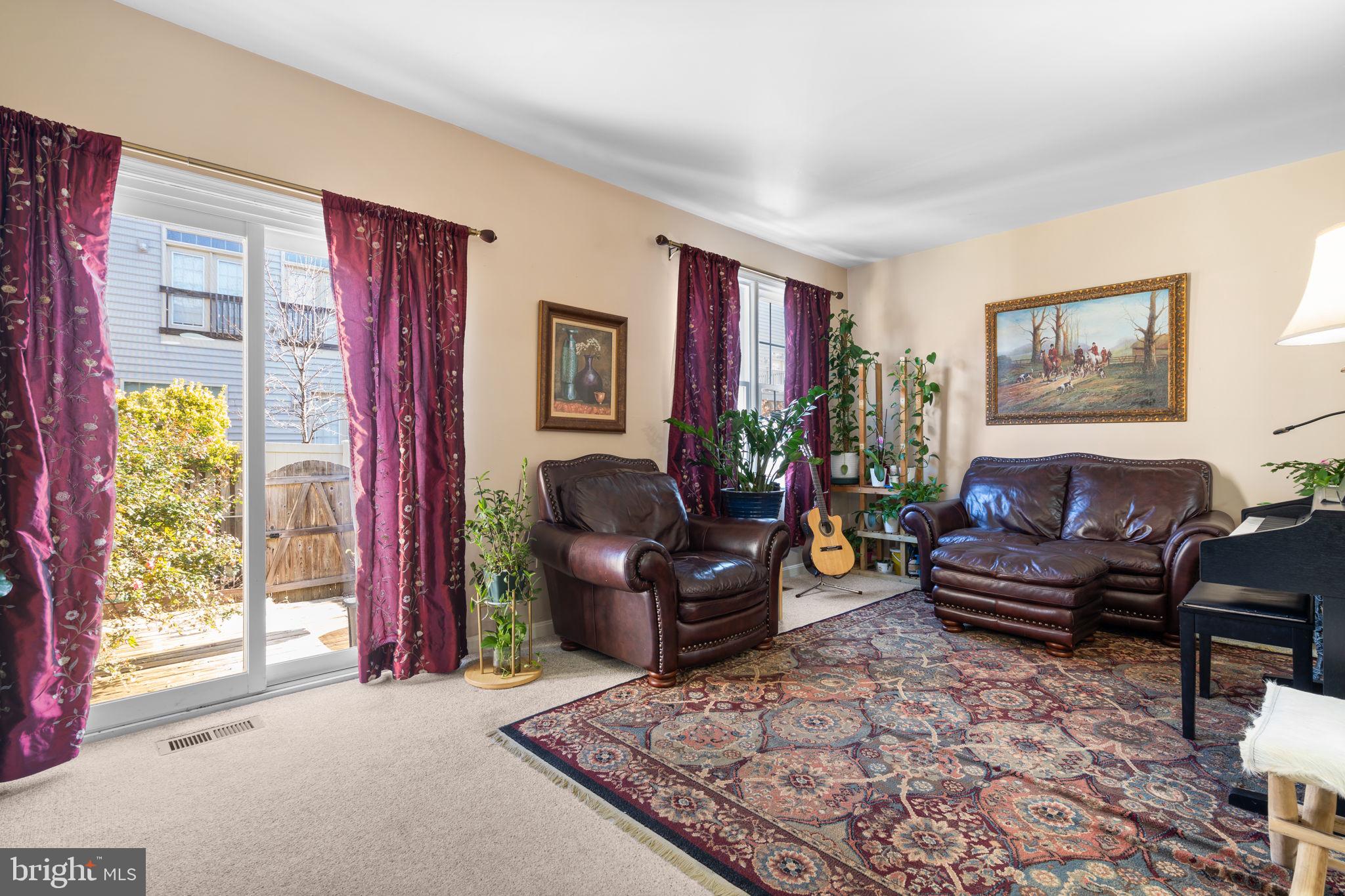 1043 Windrush Lane, Unit 5 Sandy Spring, MD 20860 - Photo 3 of 28 a living room with furniture and a window