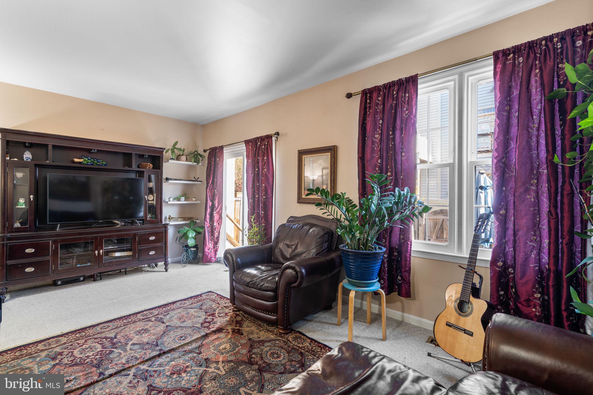 1043 Windrush Lane, Unit 5 Sandy Spring, MD 20860 - Photo 4 of 28 a living room with furniture and a flat screen tv
