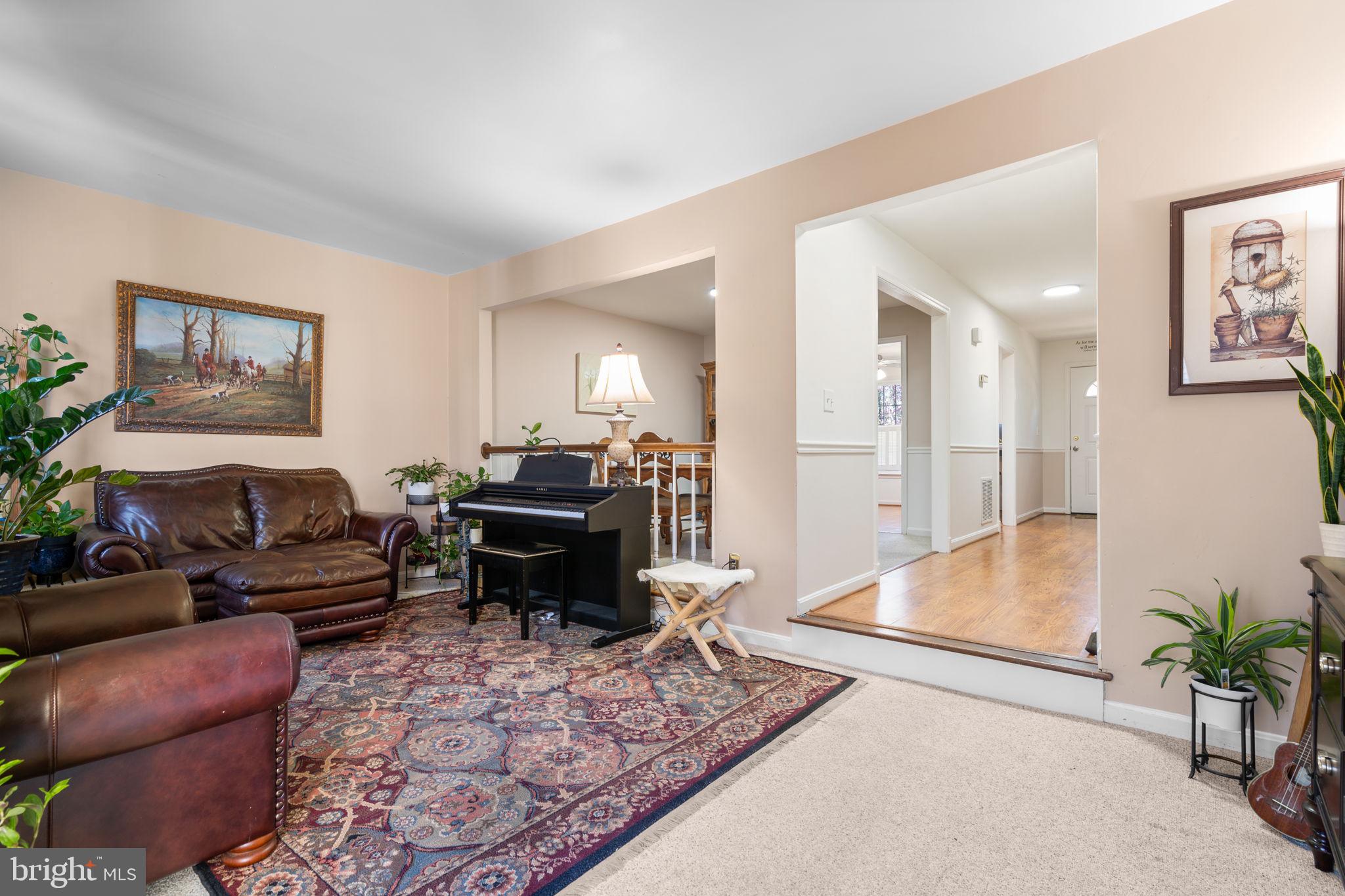 1043 Windrush Lane, Unit 5 Sandy Spring, MD 20860 - Photo 5 of 28 a living room with furniture and a couch