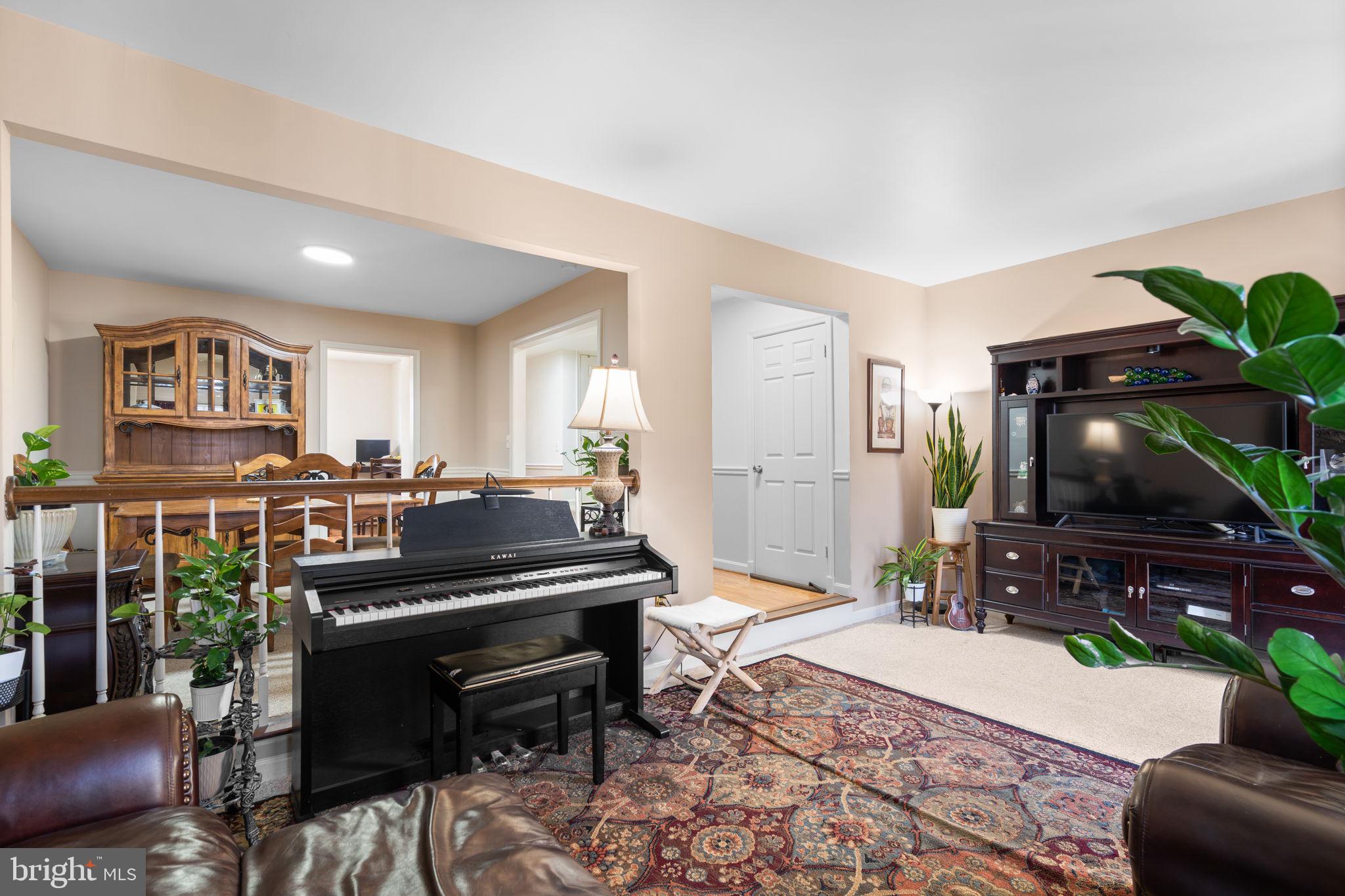 1043 Windrush Lane, Unit 5 Sandy Spring, MD 20860 - Photo 6 of 28 a living room with furniture and a flat screen tv