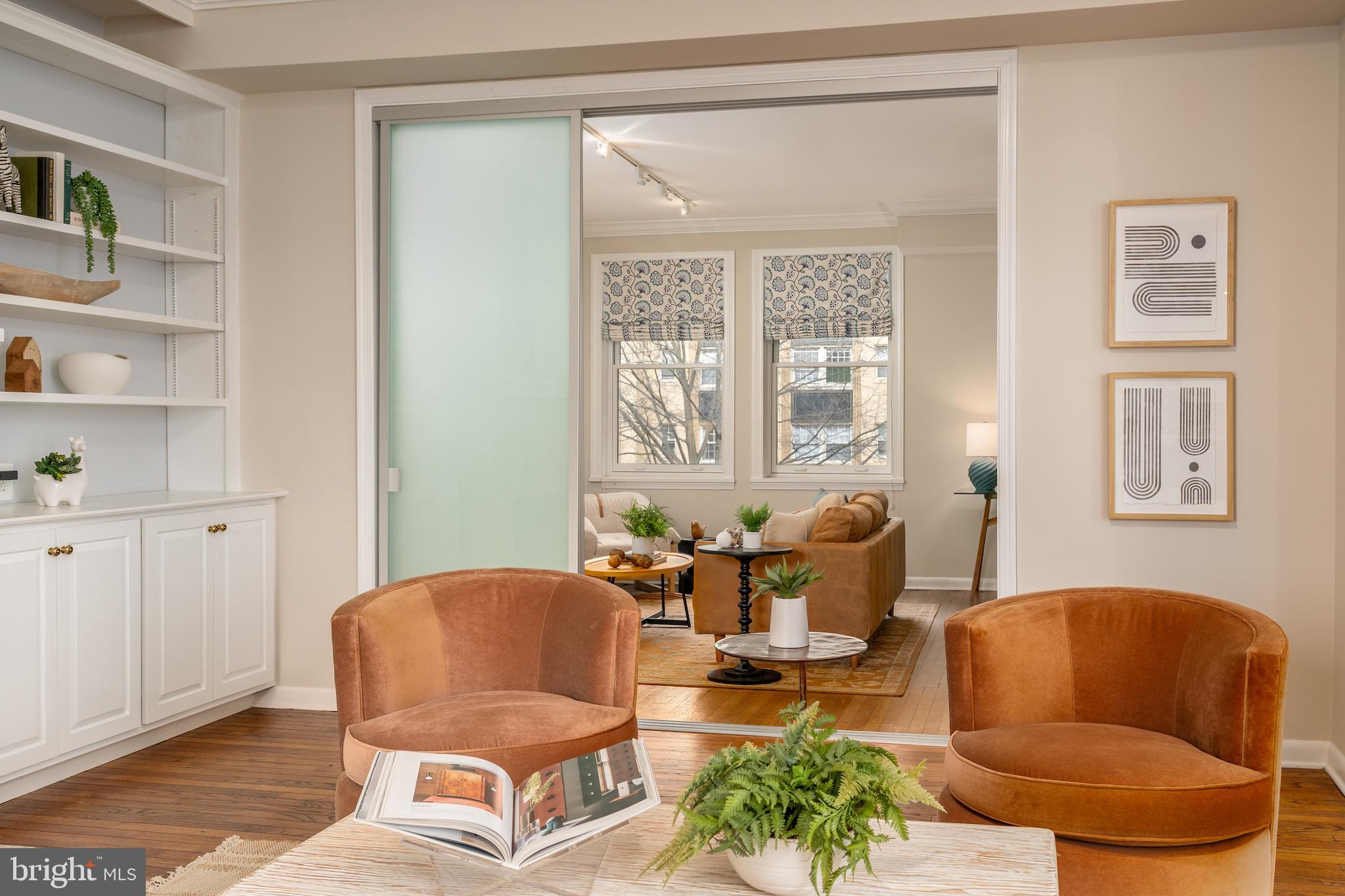 2230 California Street Northwest, Unit 3BE Washington, DC 20008 - Photo 12 of 49 a living room with furniture and a window