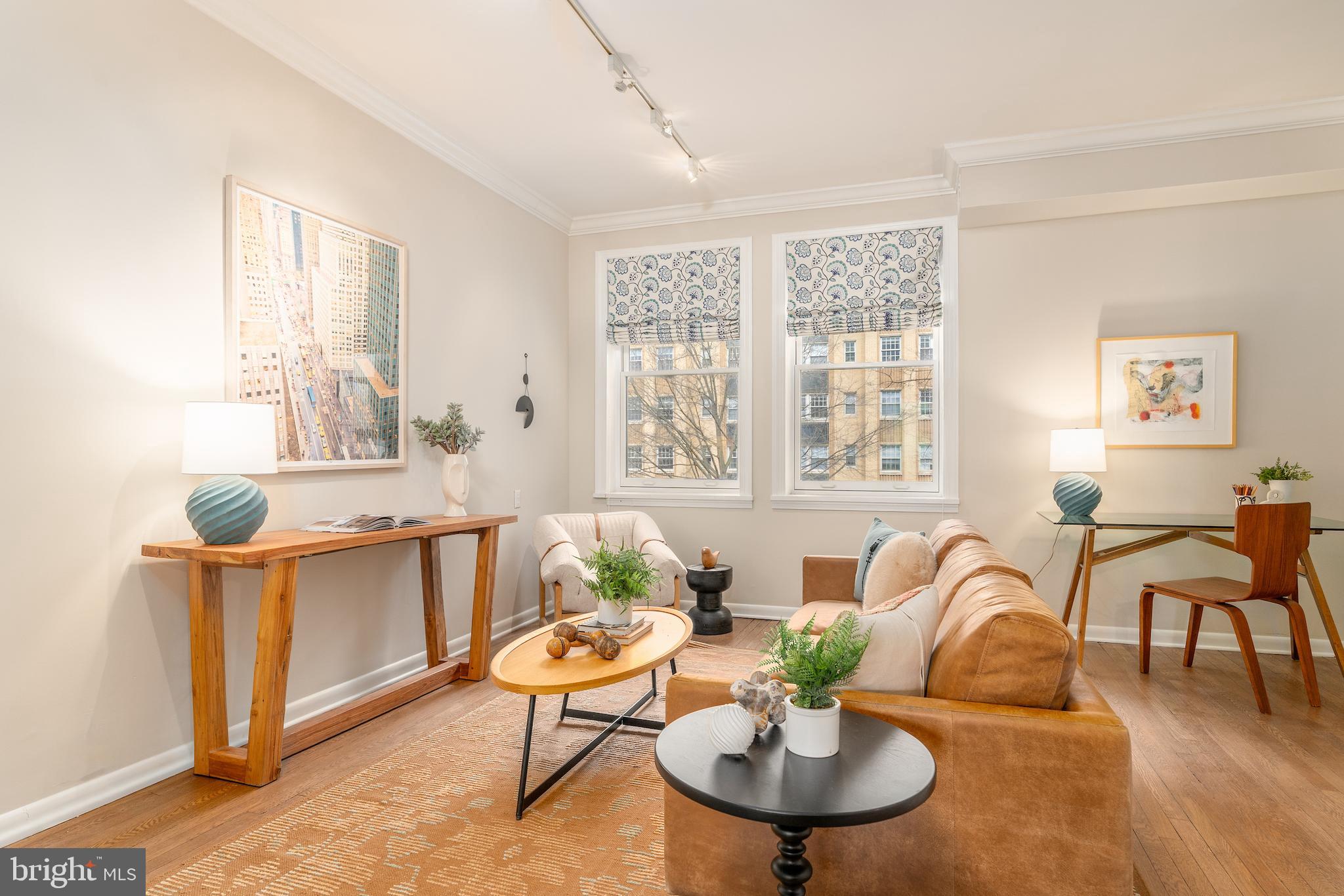 2230 California Street Northwest, Unit 3BE Washington, DC 20008 - Photo 13 of 49 a living room with furniture and a table