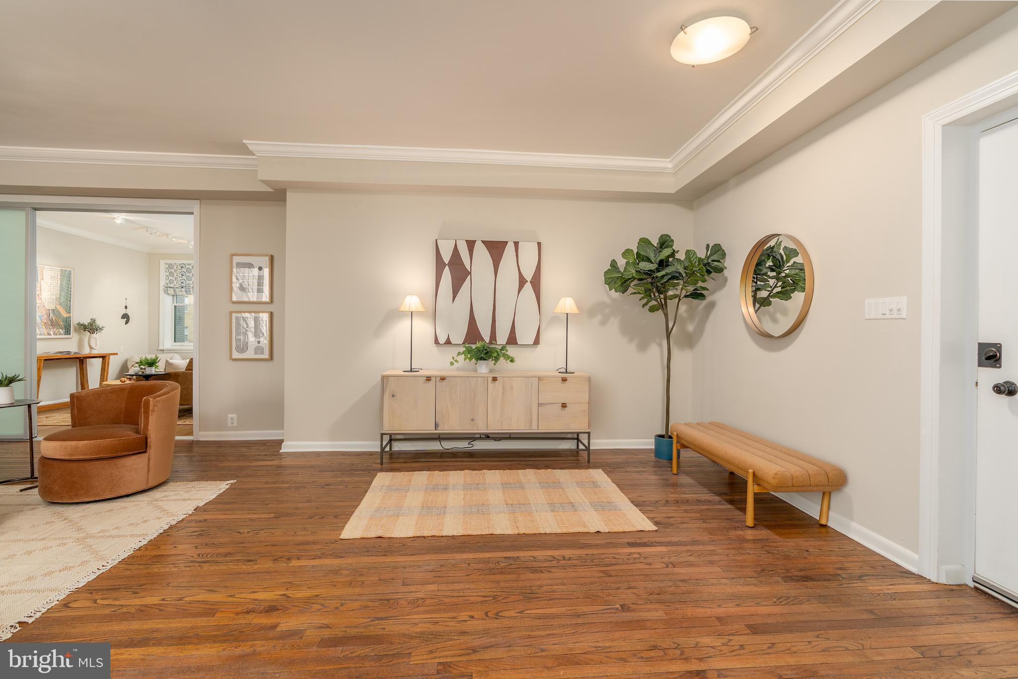 2230 California Street Northwest, Unit 3BE Washington, DC 20008 - Photo 16 of 49 a living room with furniture and a wall painting
